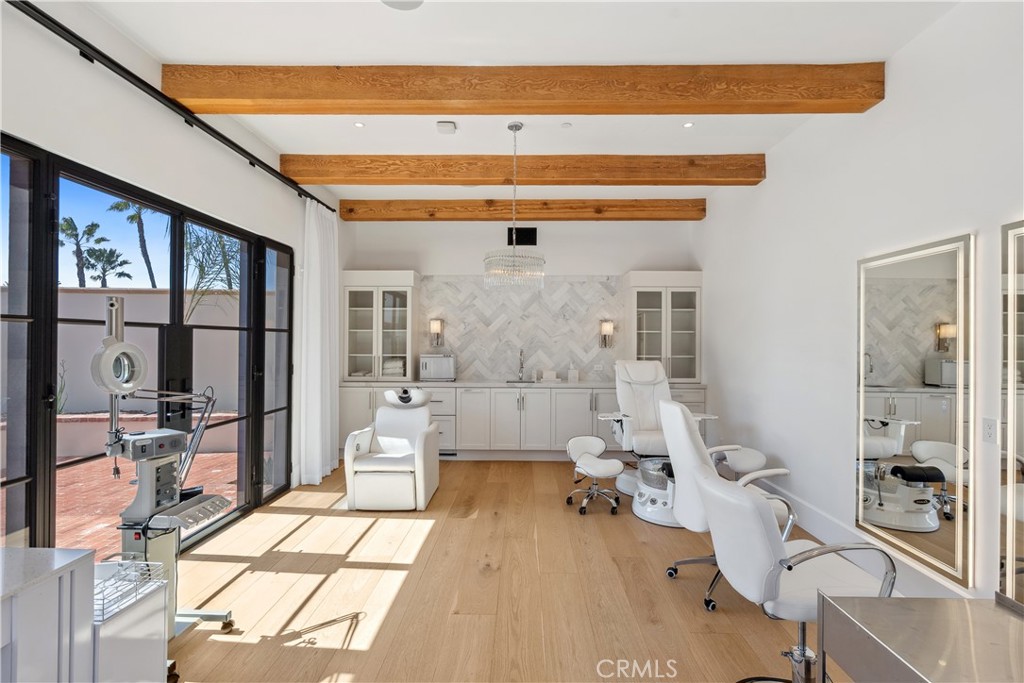 15931 Via De Santa Fe Rancho Santa Fe, CA 92067 - Photo 41 of 50 a living room with furniture a flat screen tv and a floor to ceiling window