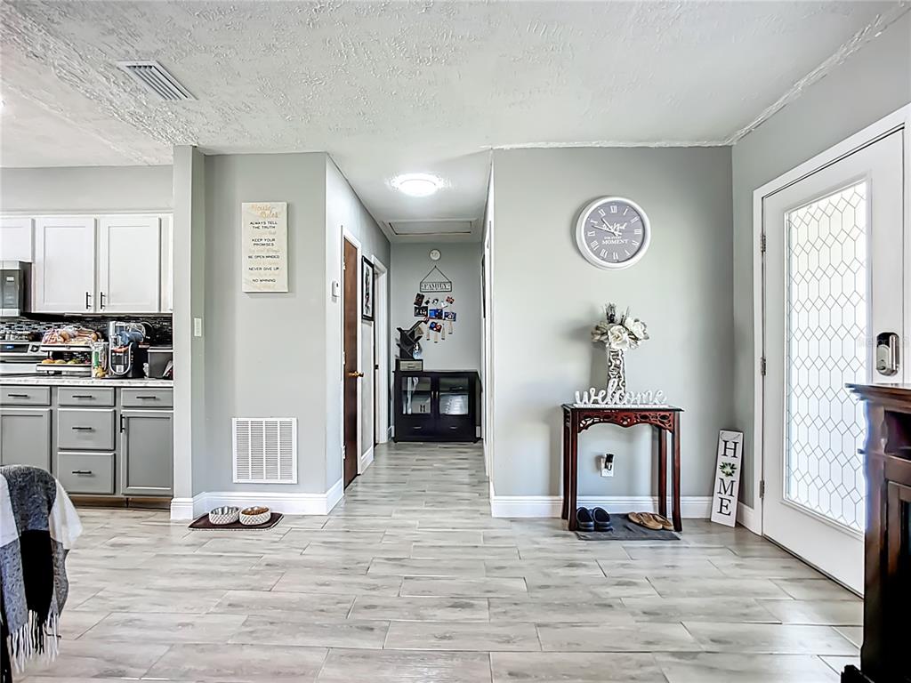 8016 Formby Street Riverview, FL 33578 - Photo 13 of 29 a view of a livingroom with kitchen and furniture
