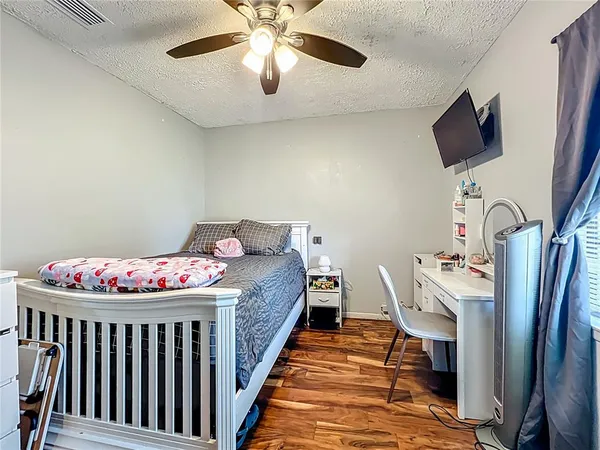 a bedroom with furniture and a chandelier