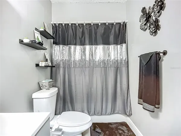 a bathroom with a toilet and a sink