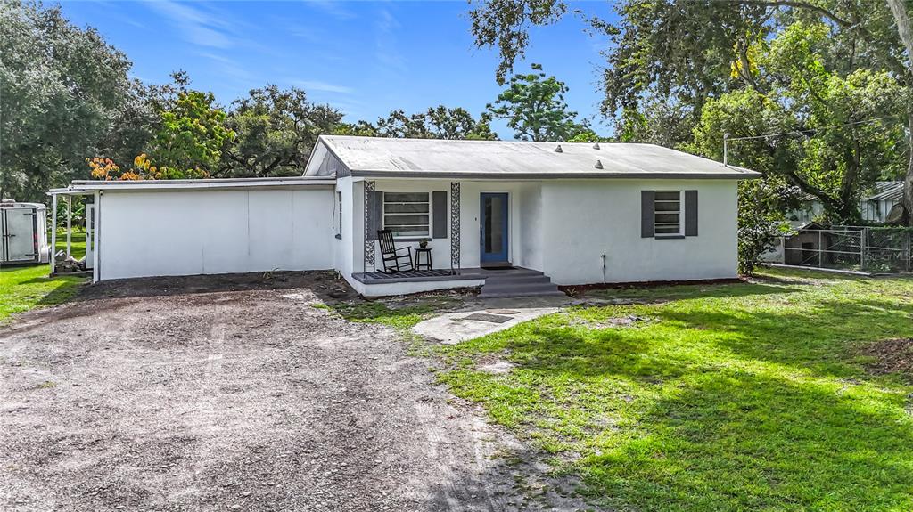 8016 Formby Street Riverview, FL 33578 - Photo 2 of 29 a house with trees in the background