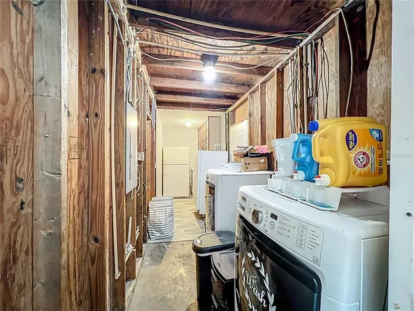a utility room with a sink a washer and dryer