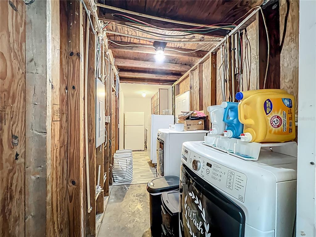 8016 Formby Street Riverview, FL 33578 - Photo 26 of 29 a utility room with a sink a washer and dryer