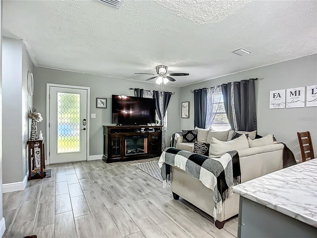 8016 Formby Street Riverview, FL 33578 - Photo 4 of 29 a living room with furniture and a flat screen tv
