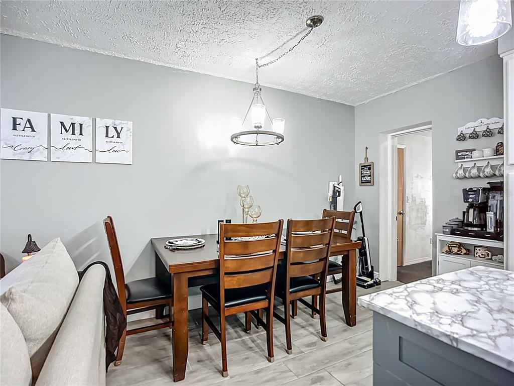 8016 Formby Street Riverview, FL 33578 - Photo 10 of 29 a view of a dining room with furniture