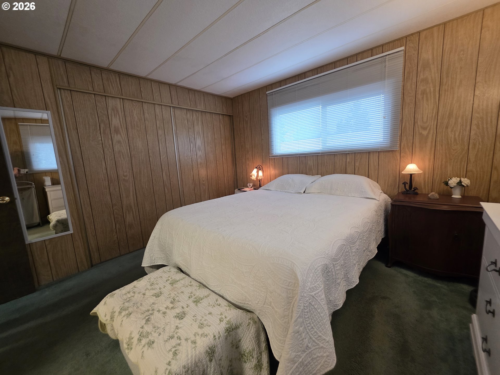 507 North 19th Avenue, Unit 49 Cornelius, OR 97113 - Photo 20 of 33 a bedroom with a bed and a lamp with window