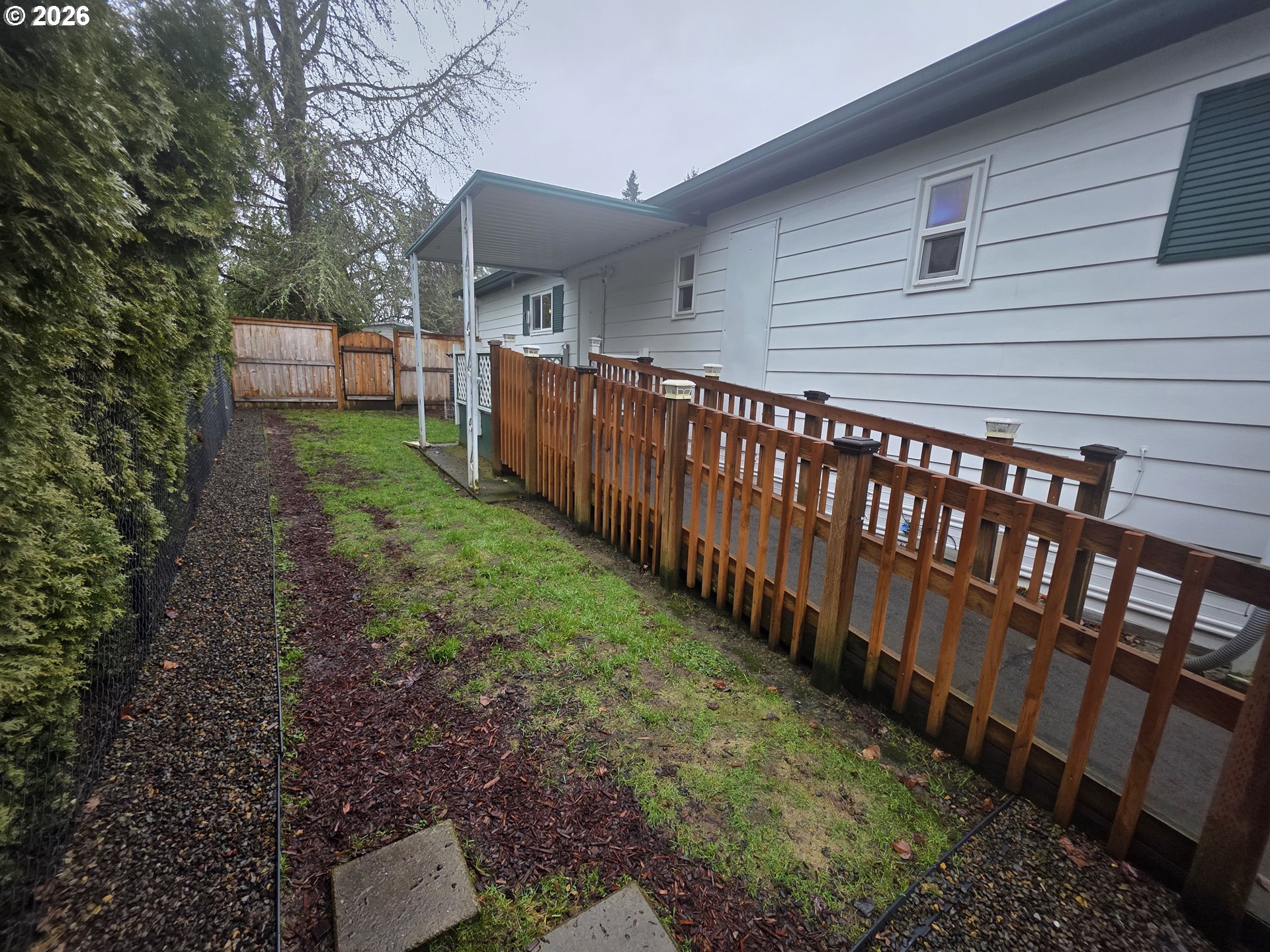 507 North 19th Avenue, Unit 49 Cornelius, OR 97113 - Photo 28 of 33 a backyard of a house with garden and deck