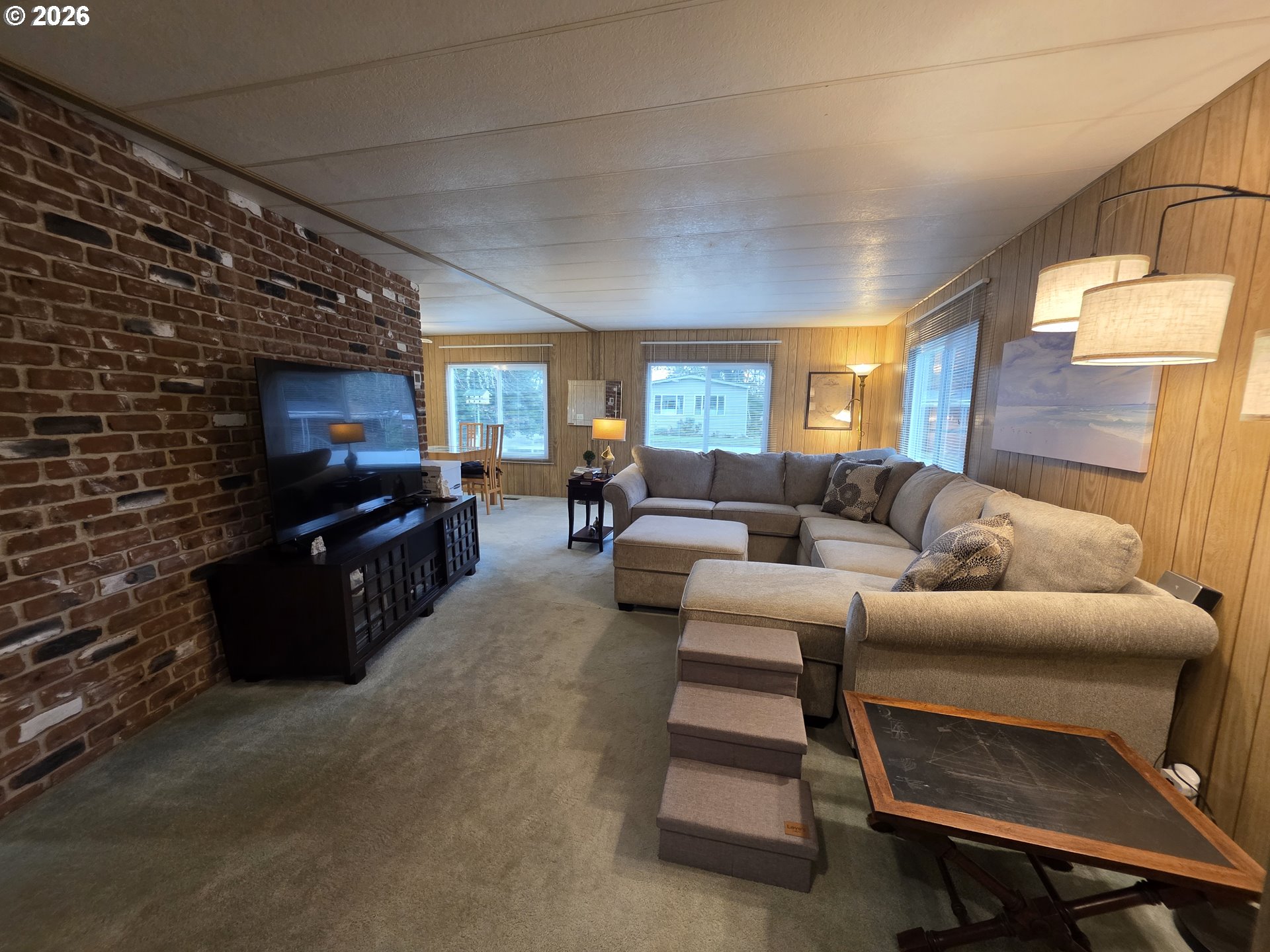 507 North 19th Avenue, Unit 49 Cornelius, OR 97113 - Photo 9 of 33 a living room with furniture and a flat screen tv