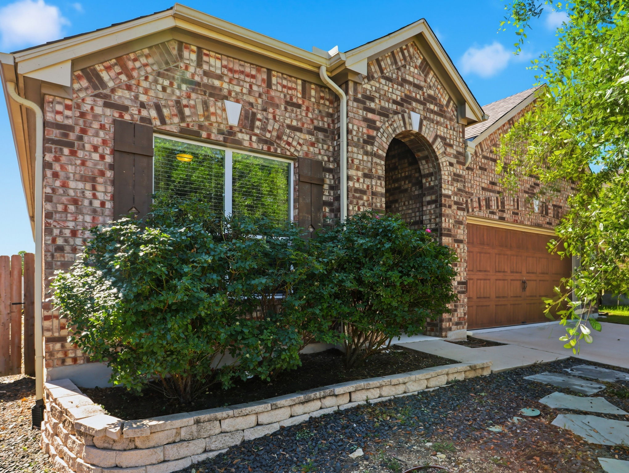 640 Landon Samuel Loop Pflugerville, TX 78660 - Photo 3 of 33 Brick exterior with arched entry