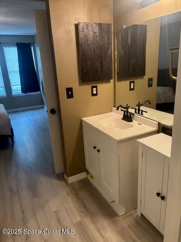 a bathroom with a sink a mirror and a toilet