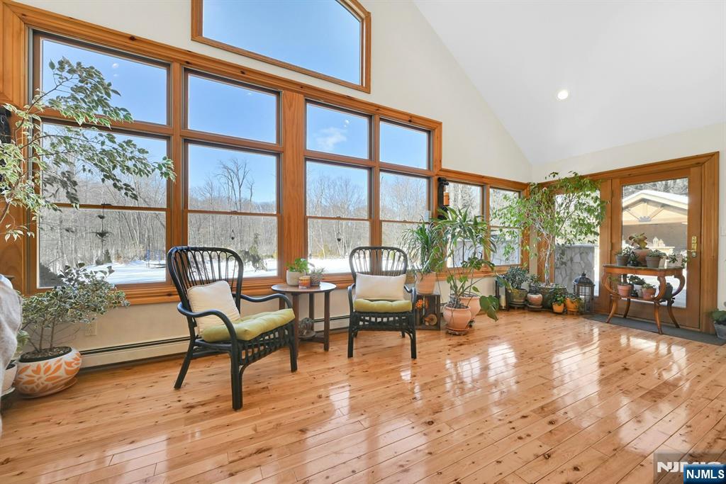 285 Chestnut Ridge Road Woodcliff Lake, NJ 07677 - Photo 26 of 46 a living room with furniture and a large window