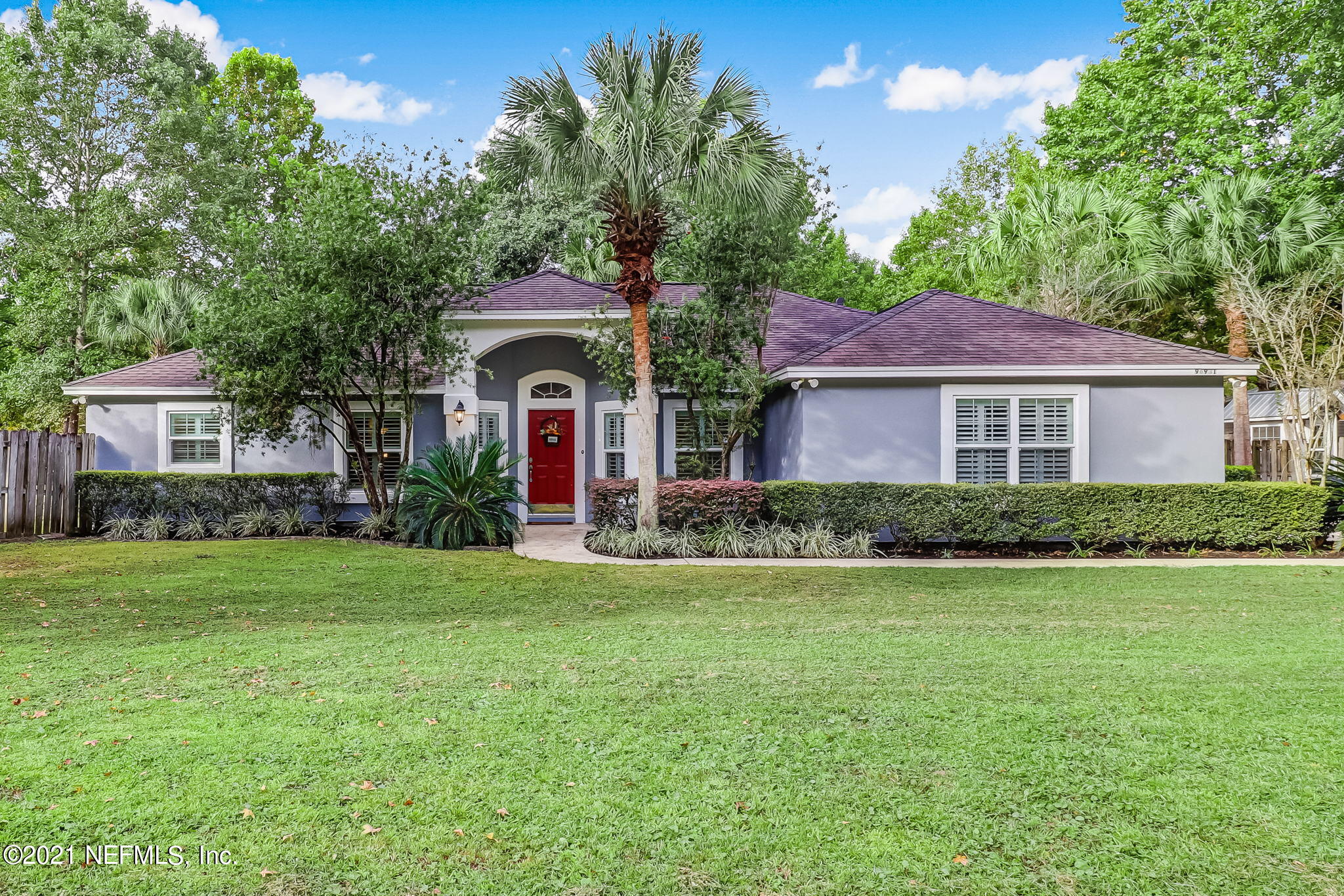 96931 Blackrock Road Yulee, FL 32097 - Photo 1 of 28 a front view of a house with a garden