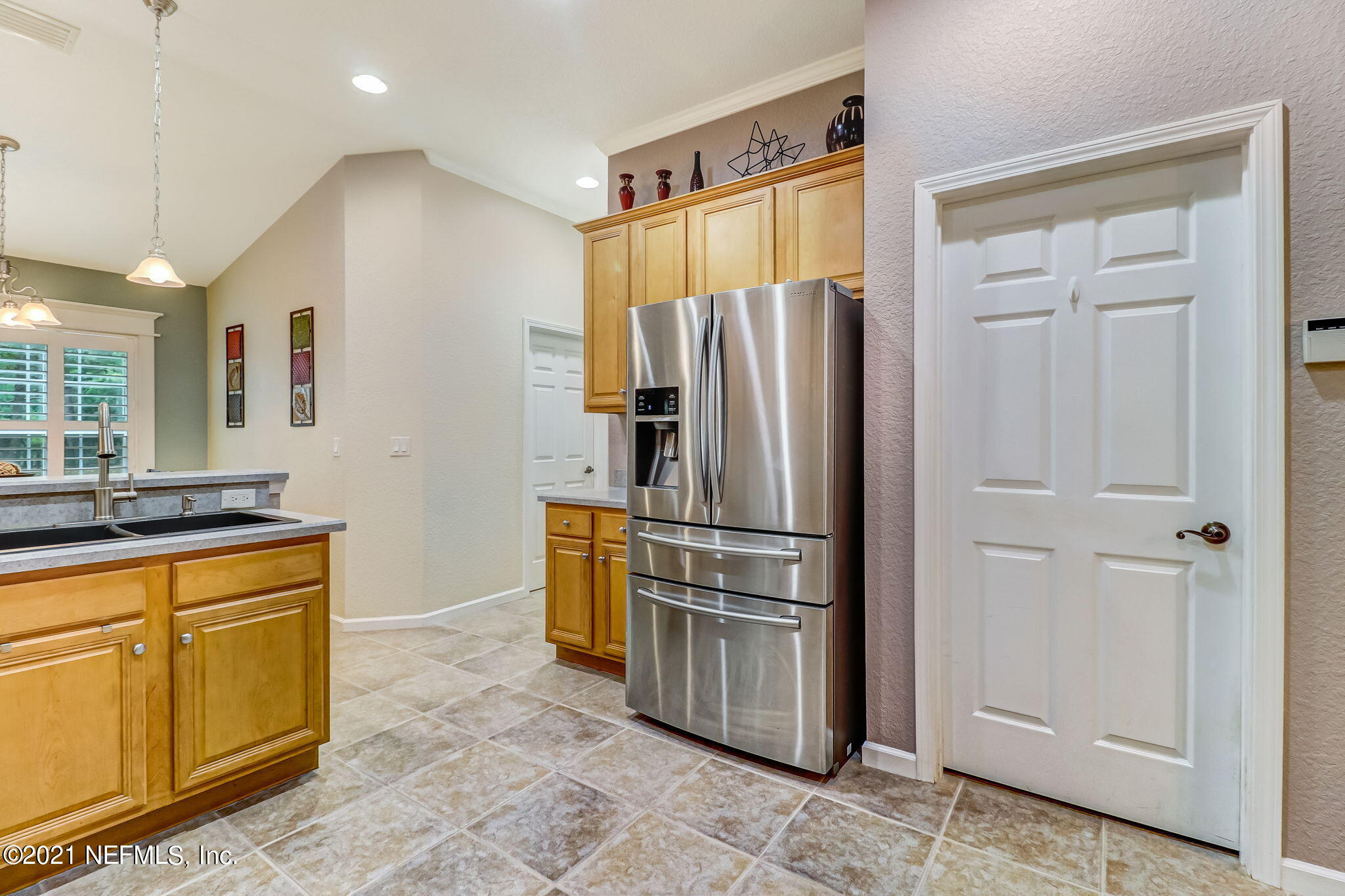 96931 Blackrock Road Yulee, FL 32097 - Photo 11 of 28 a kitchen with stainless steel appliances a refrigerator and a sink
