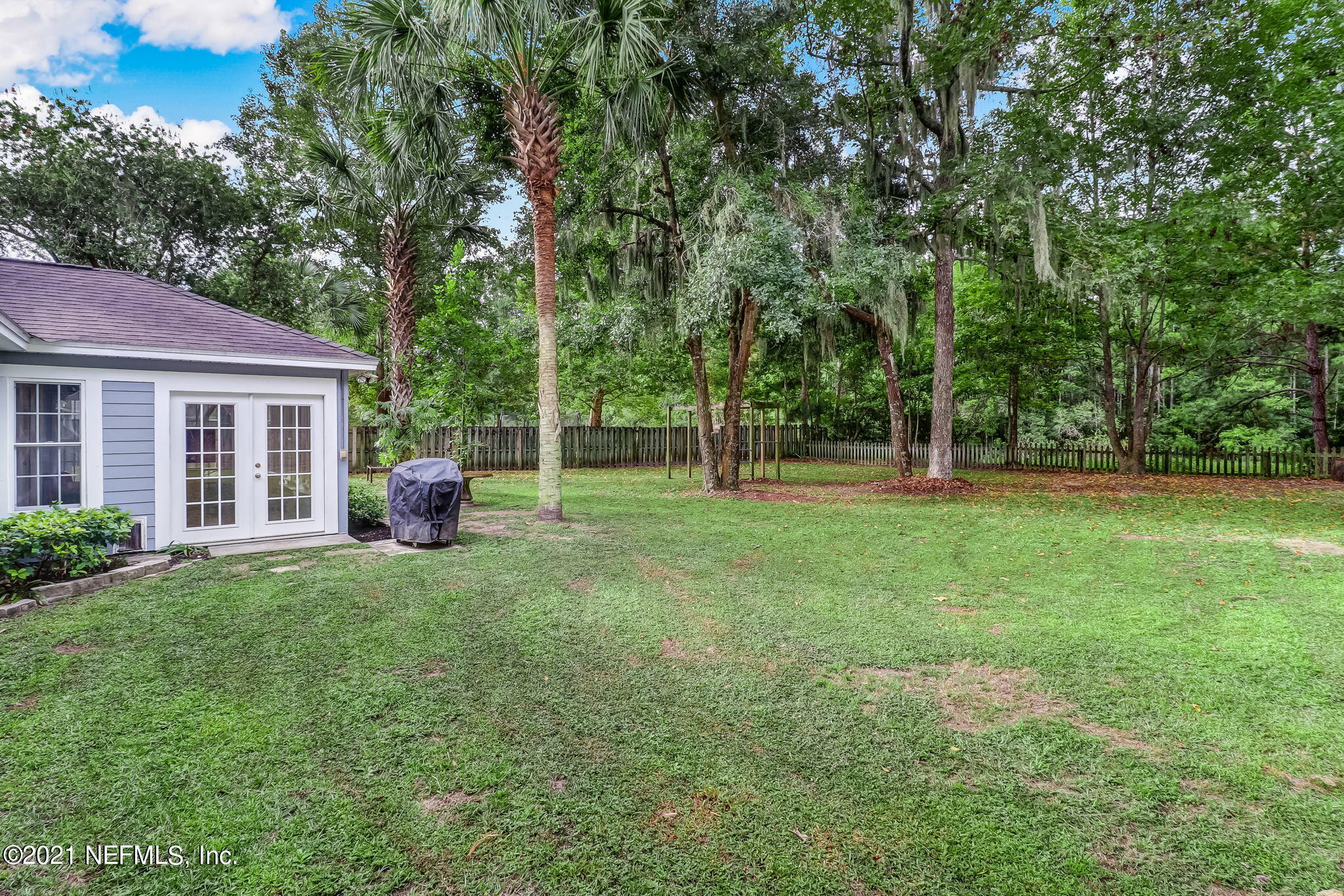96931 Blackrock Road Yulee, FL 32097 - Photo 24 of 28 a view of house with backyard space and garden