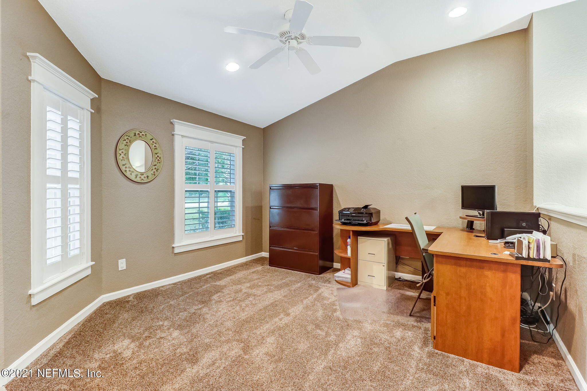 96931 Blackrock Road Yulee, FL 32097 - Photo 5 of 28 a view of a workspace with furniture and a window