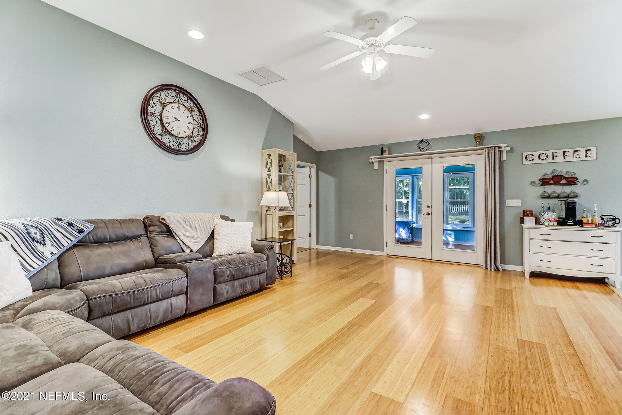 96931 Blackrock Road Yulee, FL 32097 - Photo 9 of 28 a living room with furniture and a clock