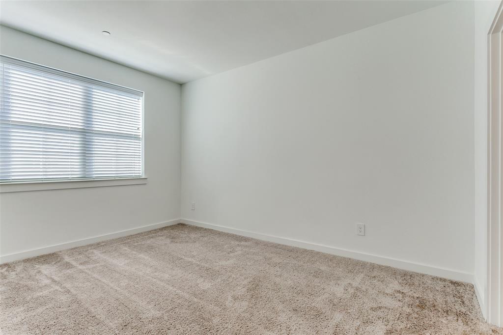 663 Vista Oaks Road Lewisville, TX 75067 - Photo 8 of 12 an empty room with a window