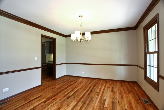 1932 Slippery Rock Road Naperville, IL 60565 - Photo 4 of 14 a view of empty room with wooden floor and fan