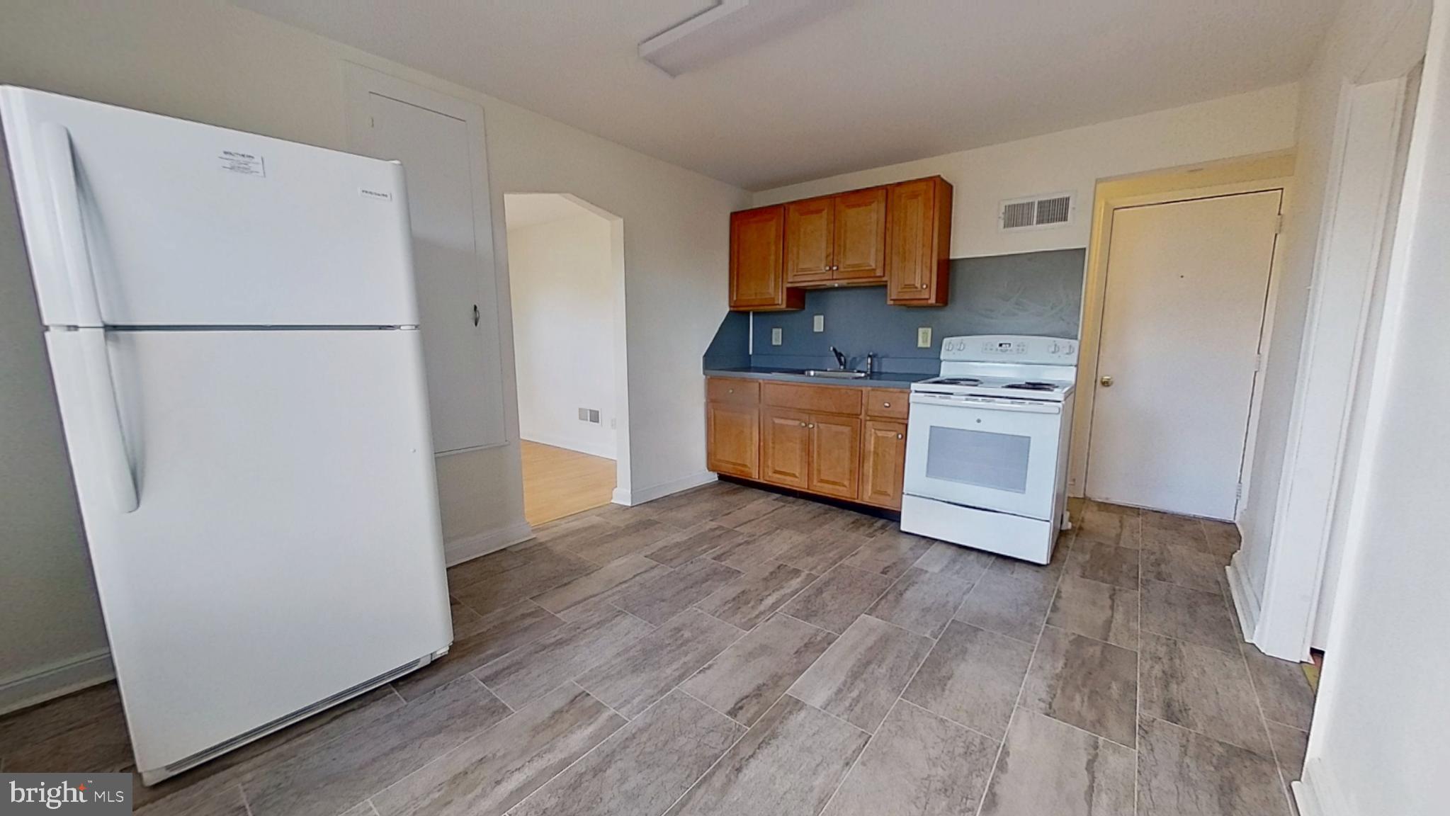 22 Pleasant Avenue Red Lion, PA 17356 - Photo 2 of 9 a kitchen with stainless steel appliances granite countertop a refrigerator a stove top oven a sink and dishwasher