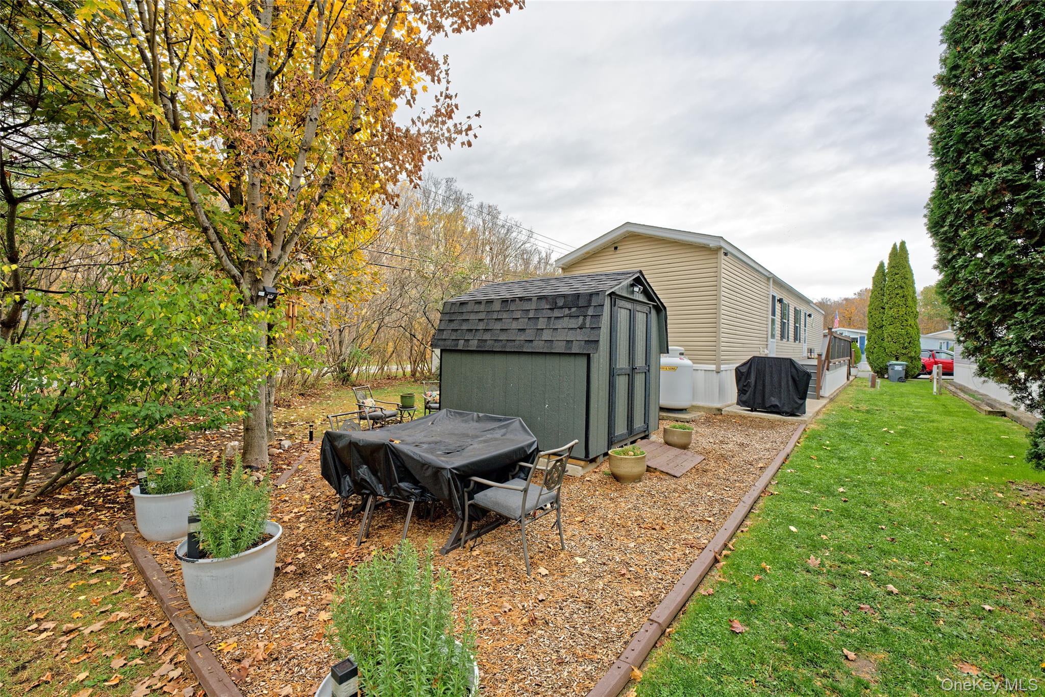 28 Matthew Drive Castleton-on-Hudson, NY 12033 - Photo 22 of 26 View of green lawn with a storage unit