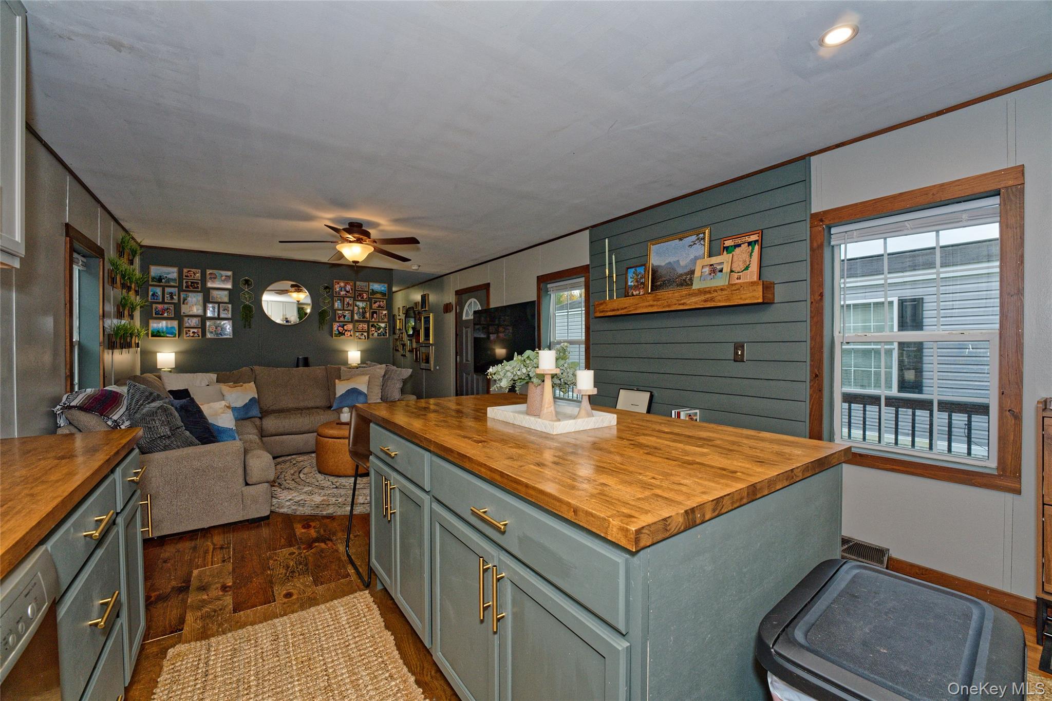 28 Matthew Drive Castleton-on-Hudson, NY 12033 - Photo 26 of 26 Kitchen featuring wooden counters, open floor plan, ceiling fan, dark wood-type flooring, and wood walls