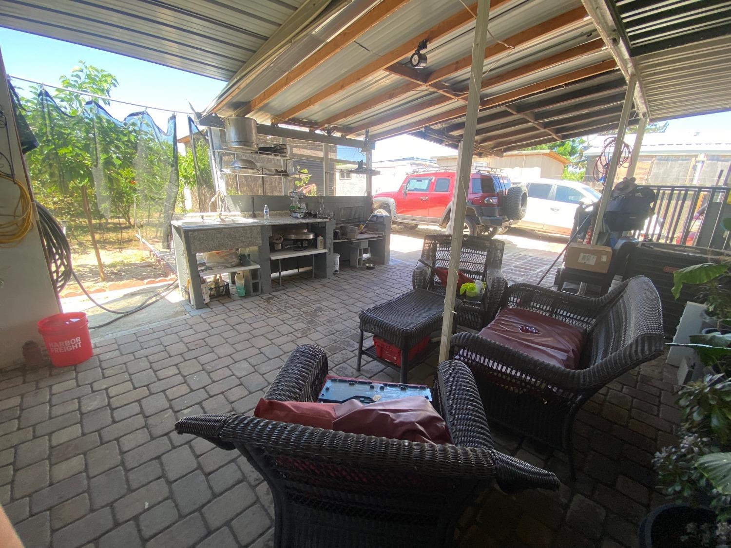 6289 Monica Way Winton, CA 95388 - Photo 19 of 27 a outdoor living space with patio furniture and a potted plant