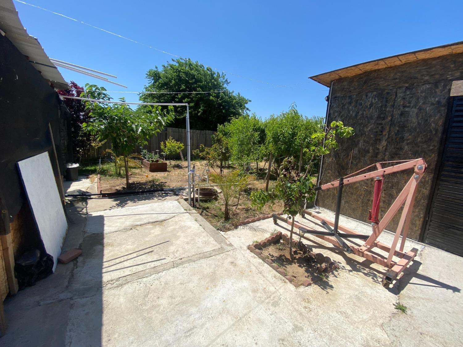 6289 Monica Way Winton, CA 95388 - Photo 24 of 27 a view of backyard with outdoor seating and plants