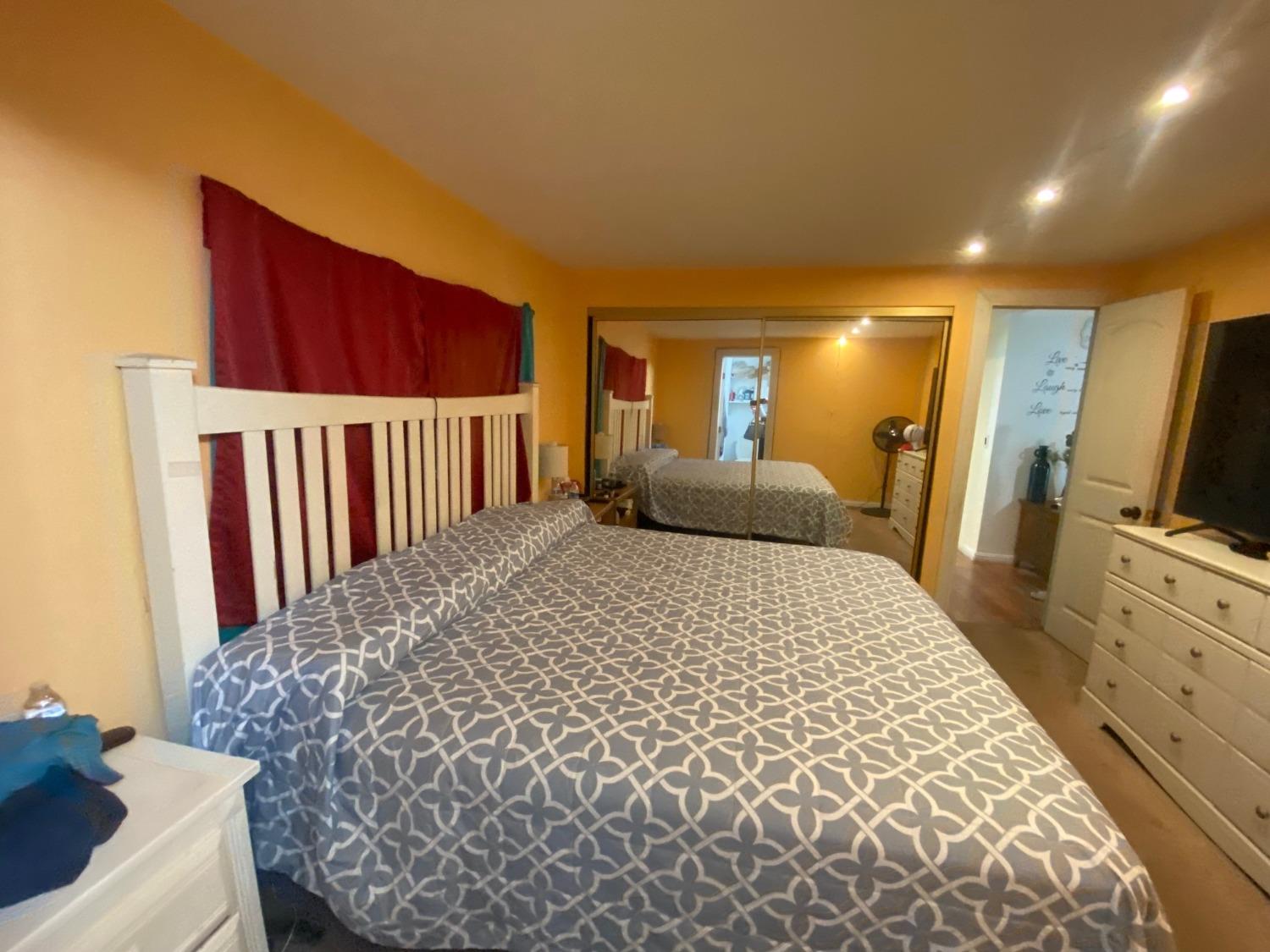 6289 Monica Way Winton, CA 95388 - Photo 5 of 27 a bed room with a bed and a television