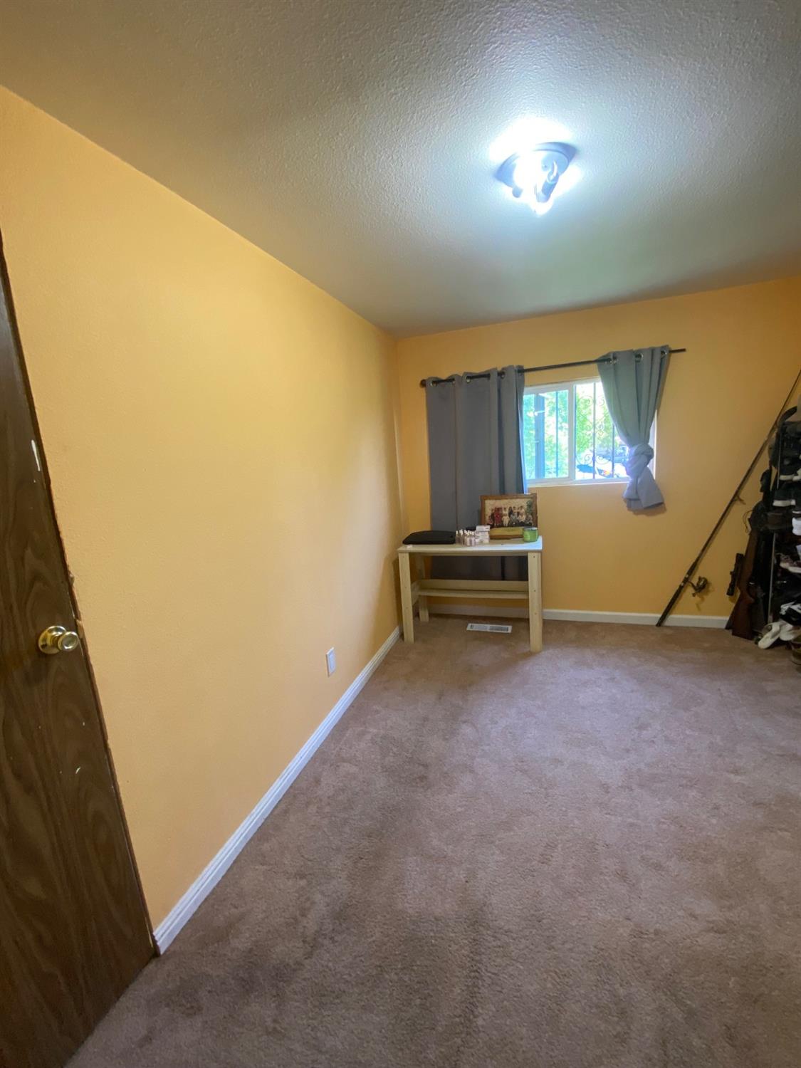 6289 Monica Way Winton, CA 95388 - Photo 8 of 27 a view of room with stairs and windows