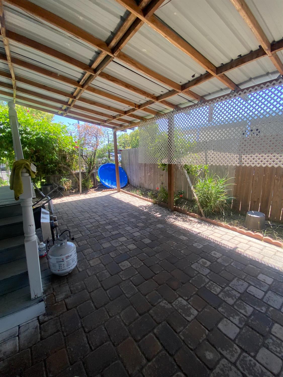 6289 Monica Way Winton, CA 95388 - Photo 9 of 27 a view of a porch with furniture and a backyard