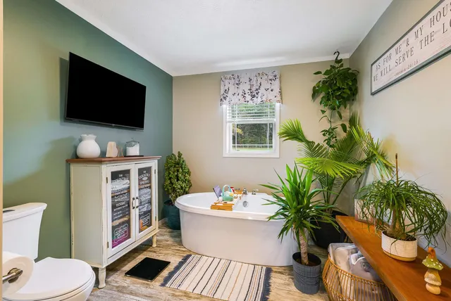 a bedroom with a bed and furniture