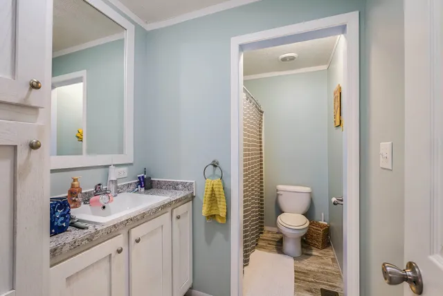a view of a deck with chairs a barbeque with wooden floor and fence