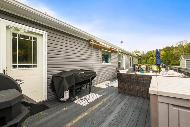 a backyard of a house with barbeque oven