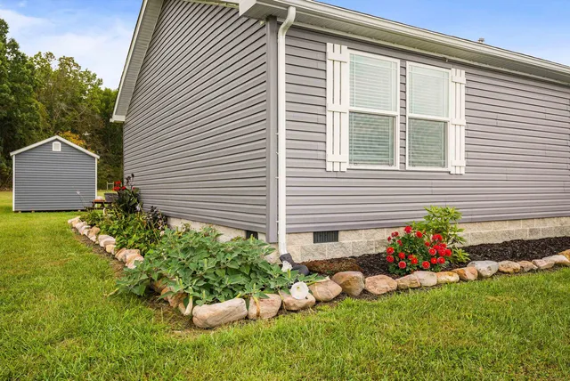a view of a balcony with lake view and wooden floor