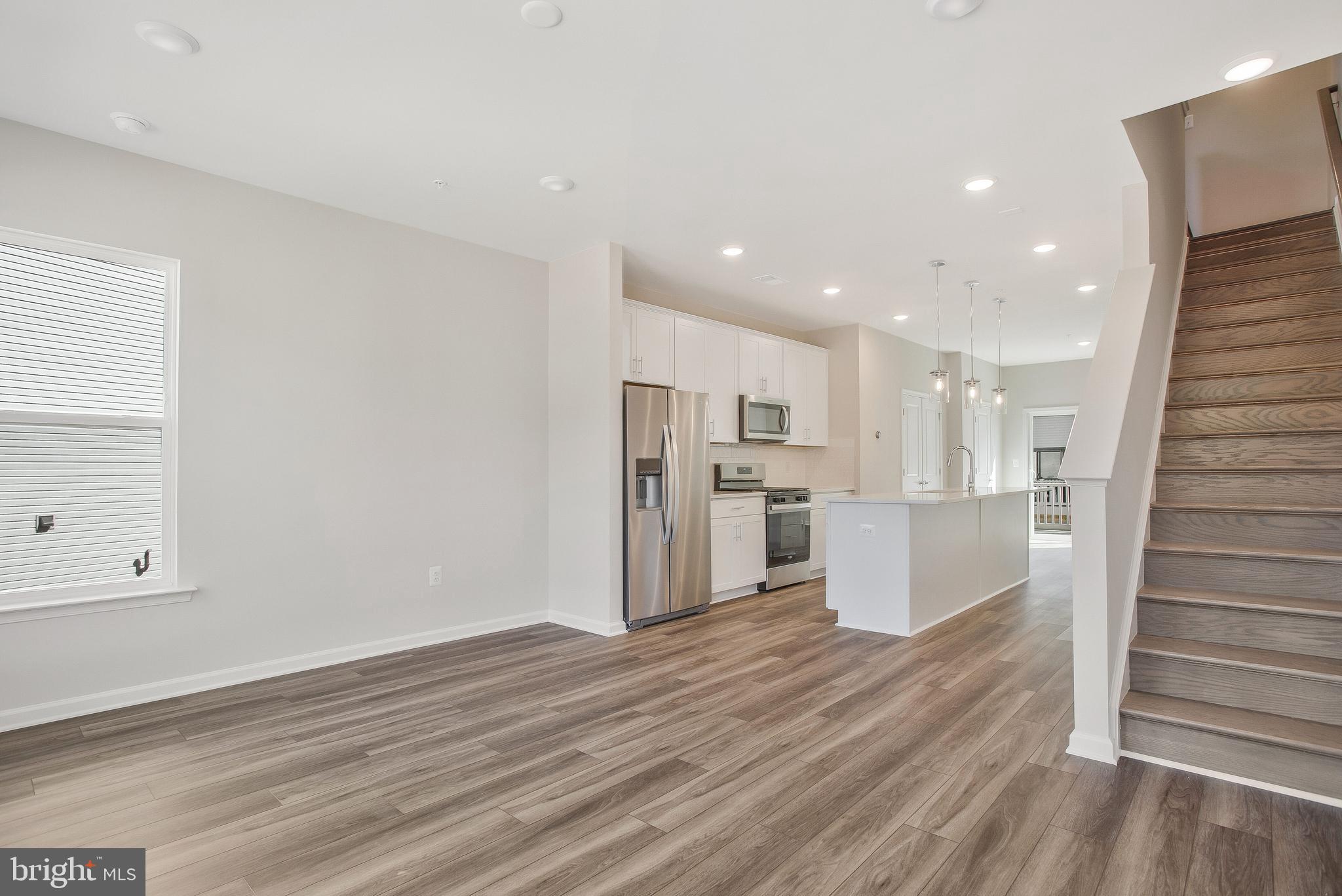 244 Mainstream Drive Laurel, MD 20724 - Photo 16 of 36 a view of kitchen view wooden floor and window