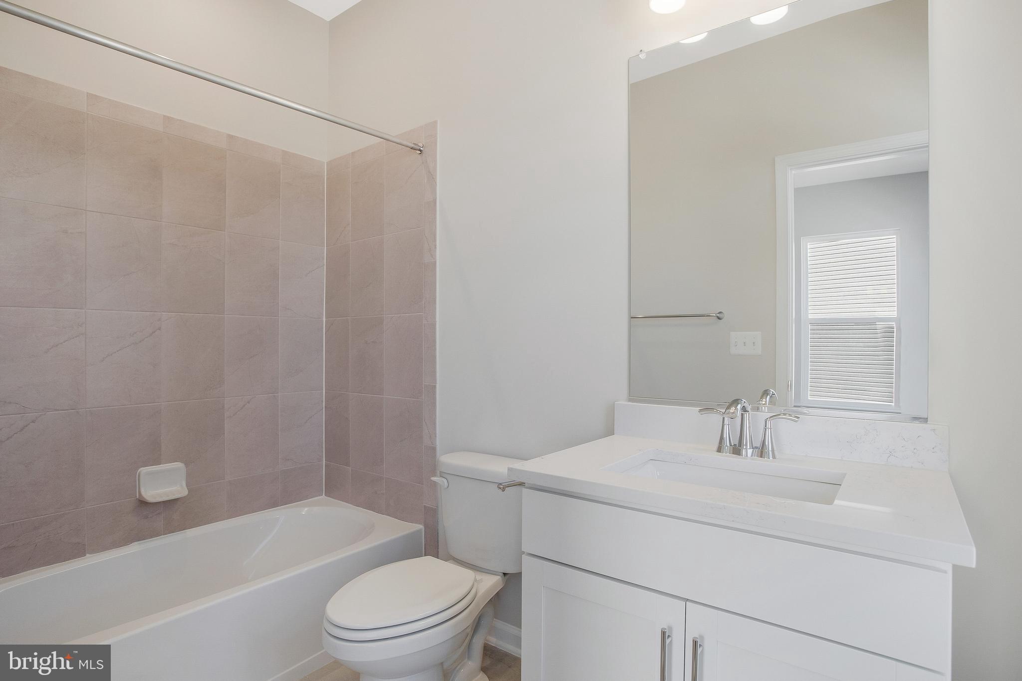 244 Mainstream Drive Laurel, MD 20724 - Photo 22 of 36 a bathroom with a sink toilet and shower