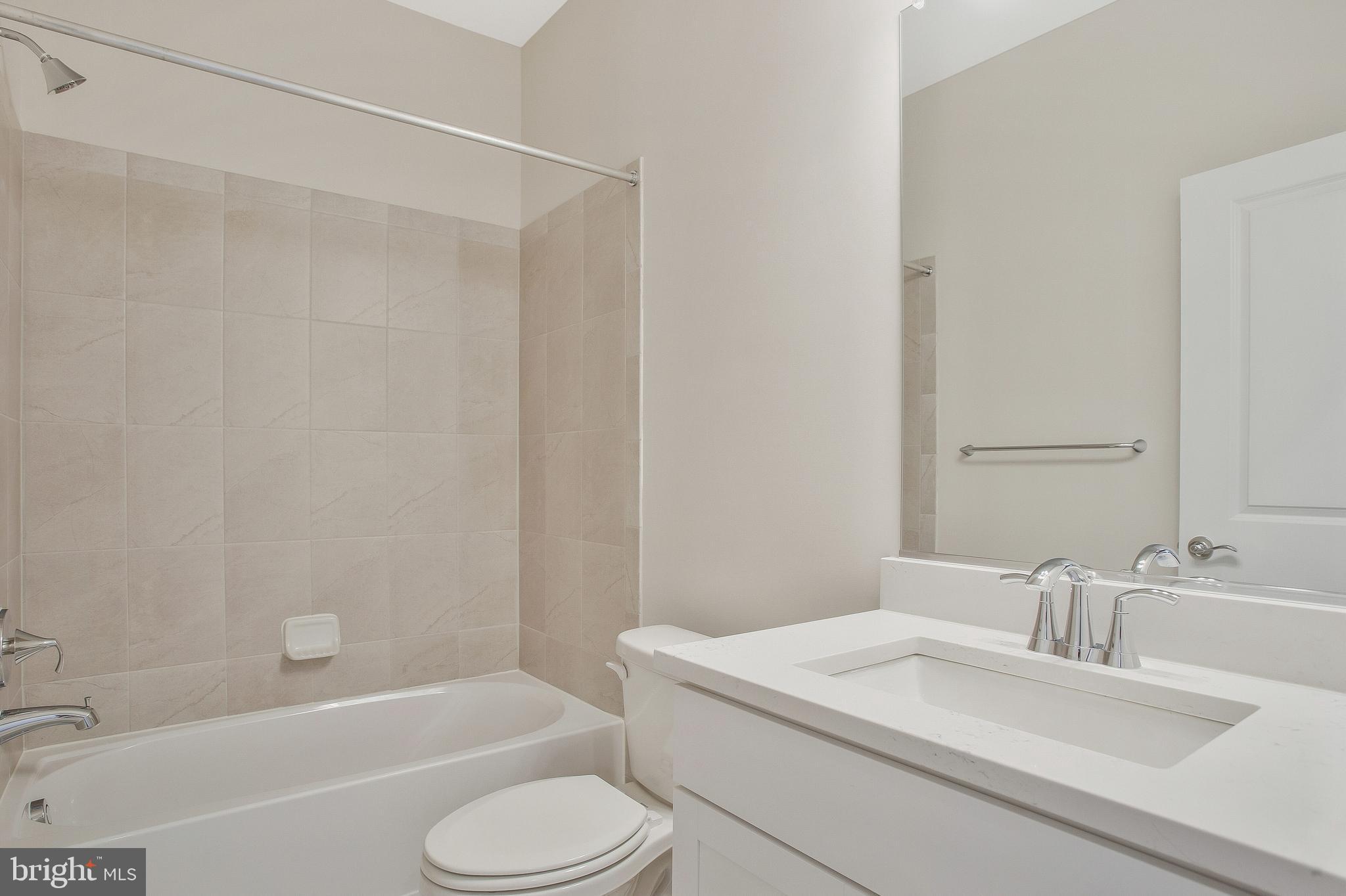 244 Mainstream Drive Laurel, MD 20724 - Photo 3 of 36 a bathroom with a sink toilet and shower