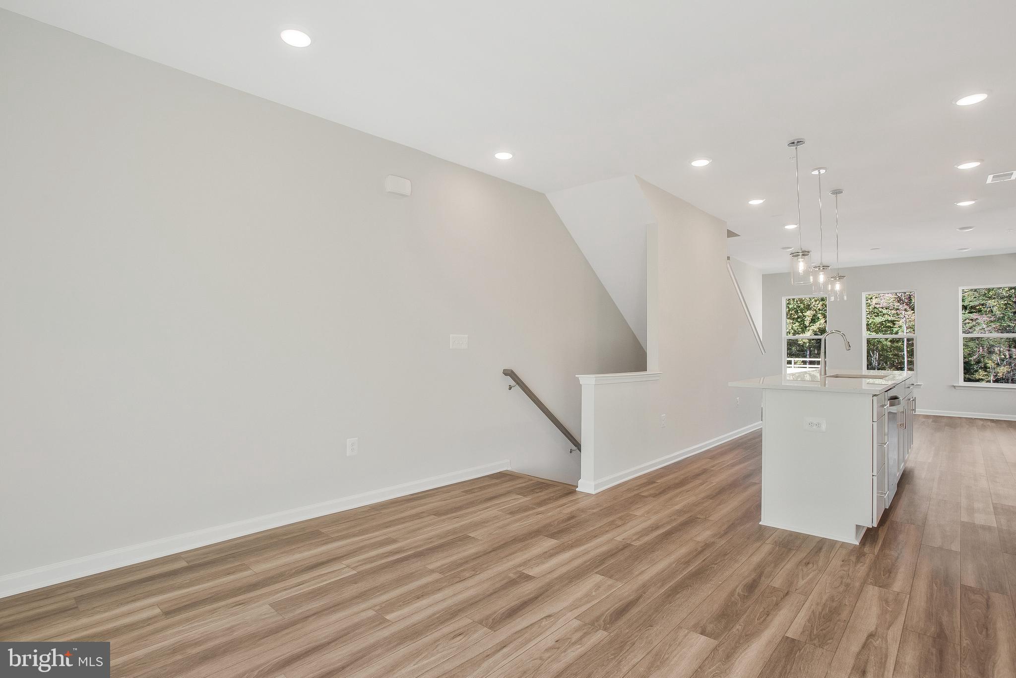 244 Mainstream Drive Laurel, MD 20724 - Photo 6 of 36 wooden floor in an empty room with a window