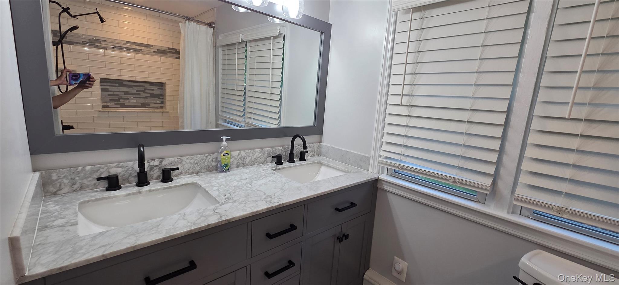 522 Moriches Road St. James, NY 11780 - Photo 38 of 49 a bathroom with a granite countertop sink and a mirror