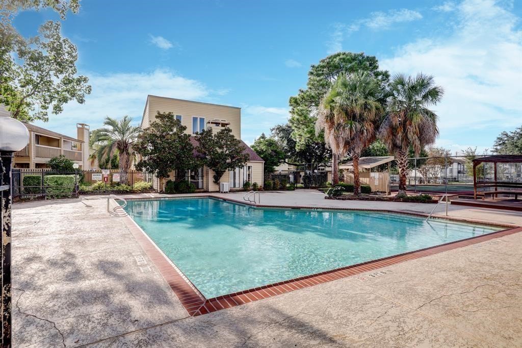 3616 Ocee Street Houston, TX 77063 - Photo 11 of 12 a view of a swimming pool with a yard