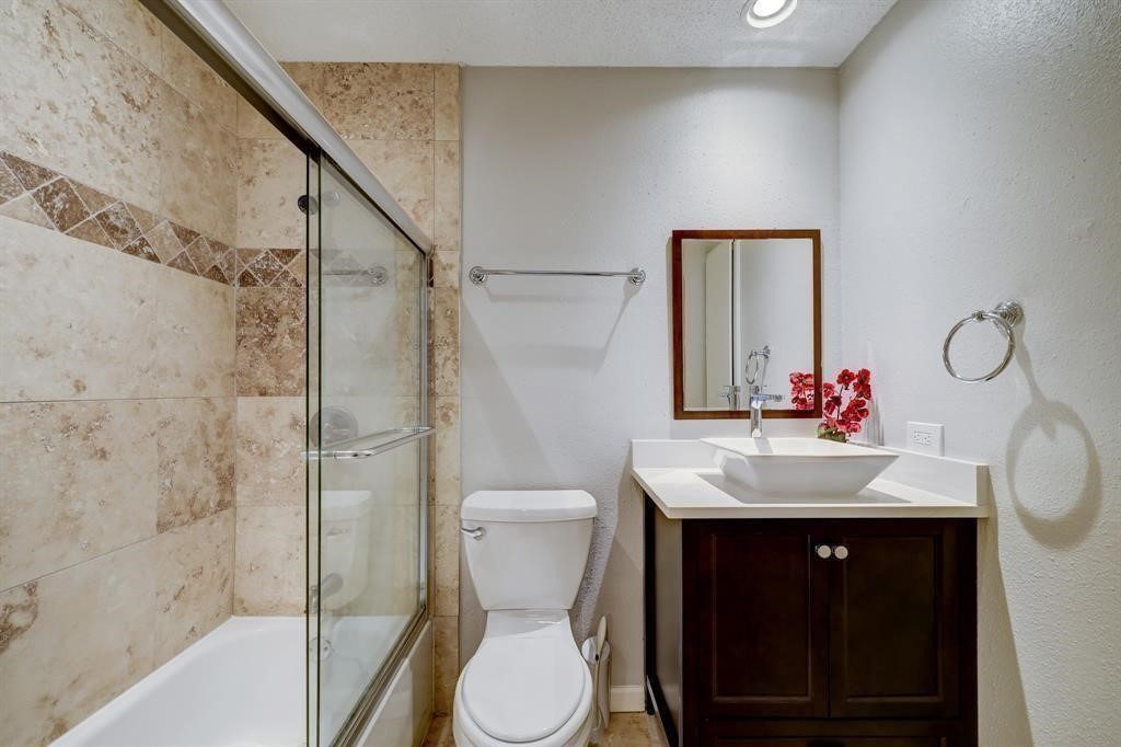 3616 Ocee Street Houston, TX 77063 - Photo 10 of 12 a bathroom with a sink toilet and shower