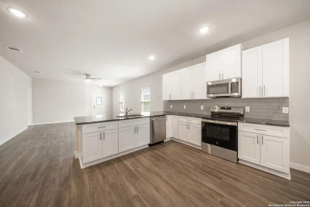 a view of kitchen with wooden floor