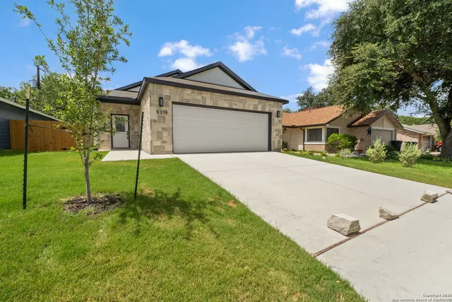 a house view with a garden space