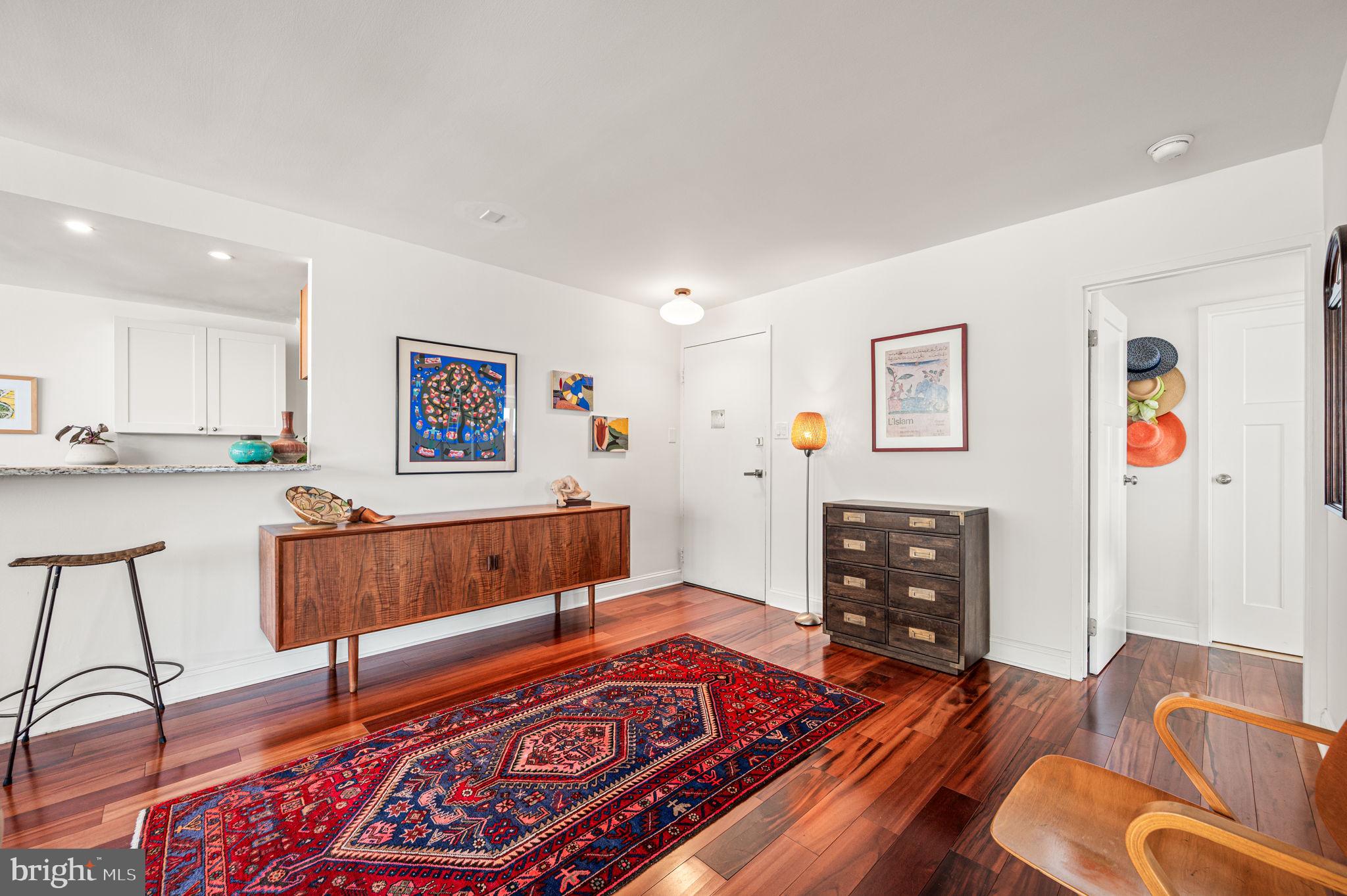 1806-18 Rittenhouse Square, Unit 190607 Philadelphia, PA 19103 - Photo 11 of 34 a living room with furniture and a flat screen tv