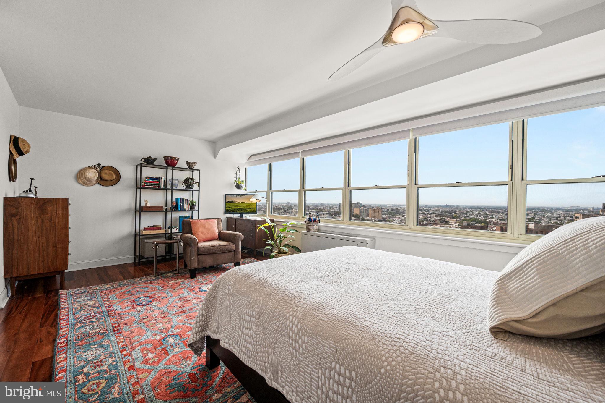 1806-18 Rittenhouse Square, Unit 190607 Philadelphia, PA 19103 - Photo 12 of 34 a spacious bedroom with a bed and a large window