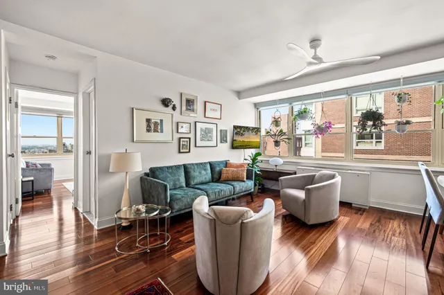 a living room with furniture and a large window