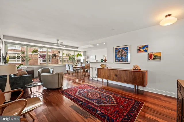 a living room with furniture and a rug