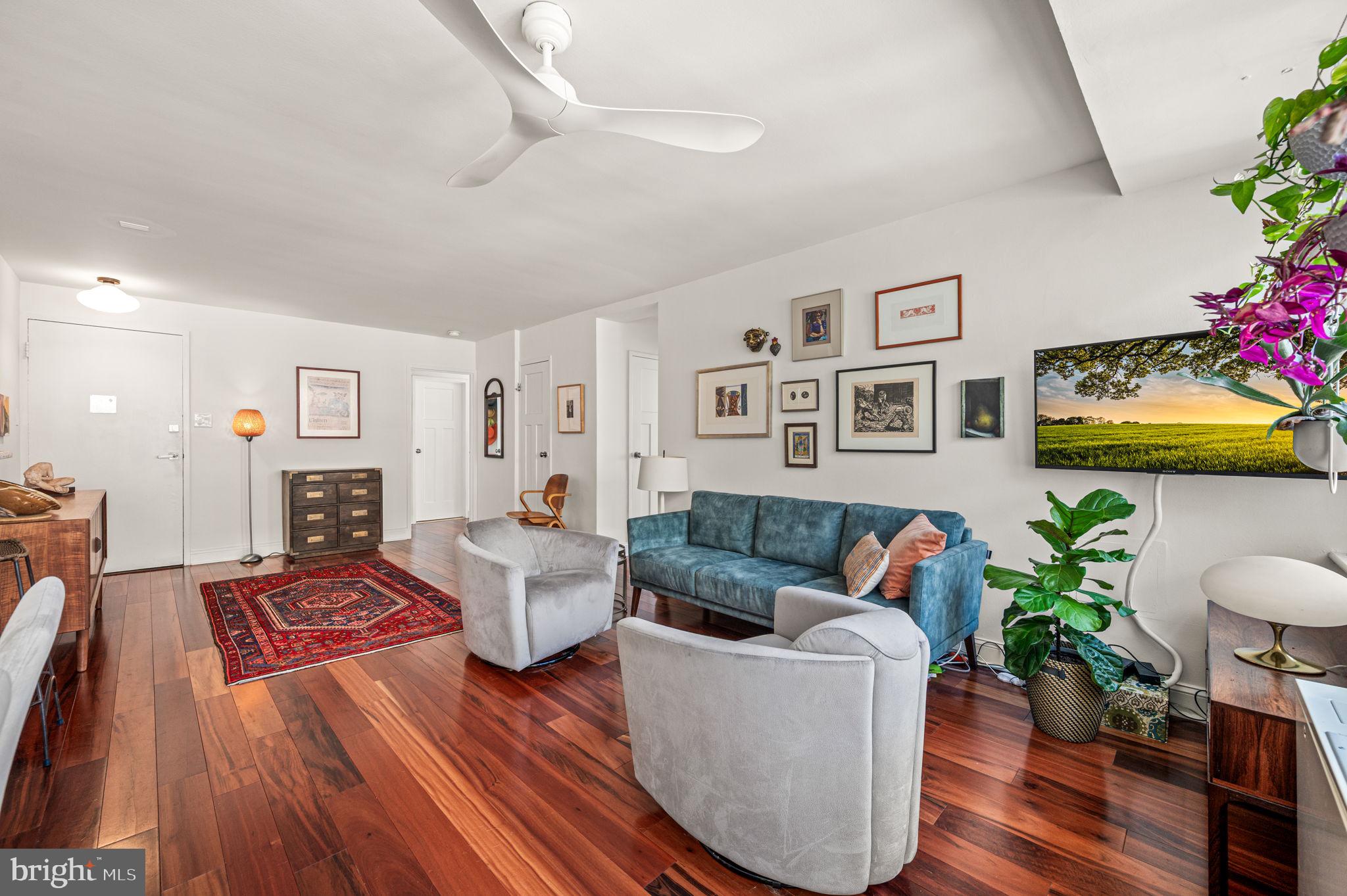 1806-18 Rittenhouse Square, Unit 190607 Philadelphia, PA 19103 - Photo 10 of 34 a living room with furniture and a potted plant