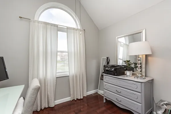 a view of room with furniture and wooden floor