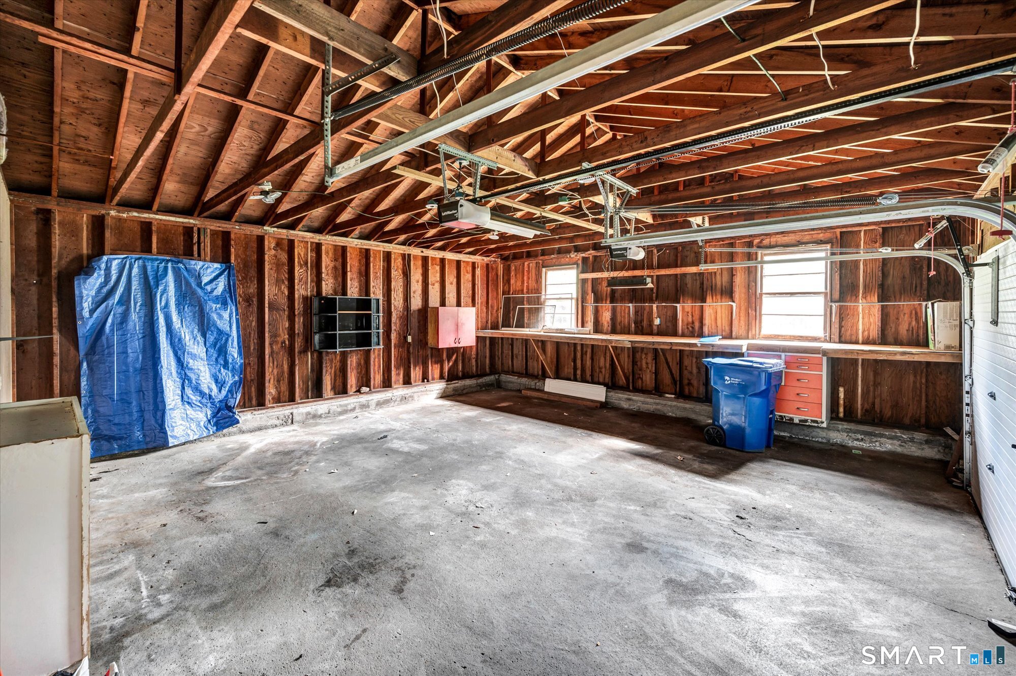 740 Rainbow Road Windsor, CT 06095 - Photo 8 of 40 a view of an empty room with wooden ceiling